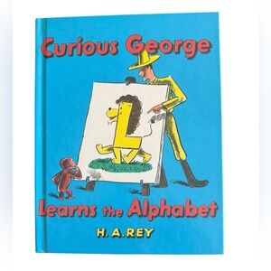 Curious George Learns the Alphabet Hardcover Book by H. A. Rey.